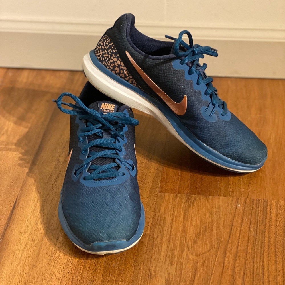 Blue and rose gold Nike training shoes